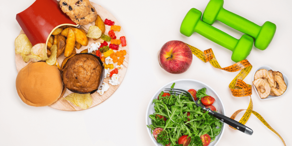 plate of fast food, a plate of salad and and some exercise equipment