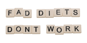 fad diets don't work spelled out on scrabble blocks