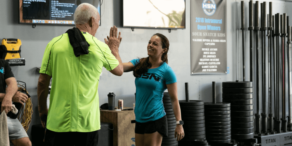 nutrition coach and client high fiving