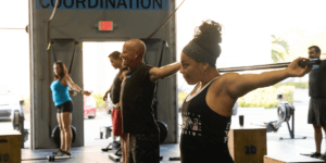 people warming up demonstrating a well oiled machine when it comes to a nutrition coaching program and gym
