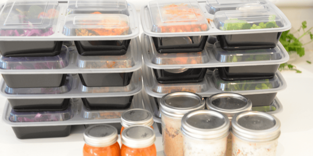 meal prep containers stacked on a table demonstrating nutrition client engagement
