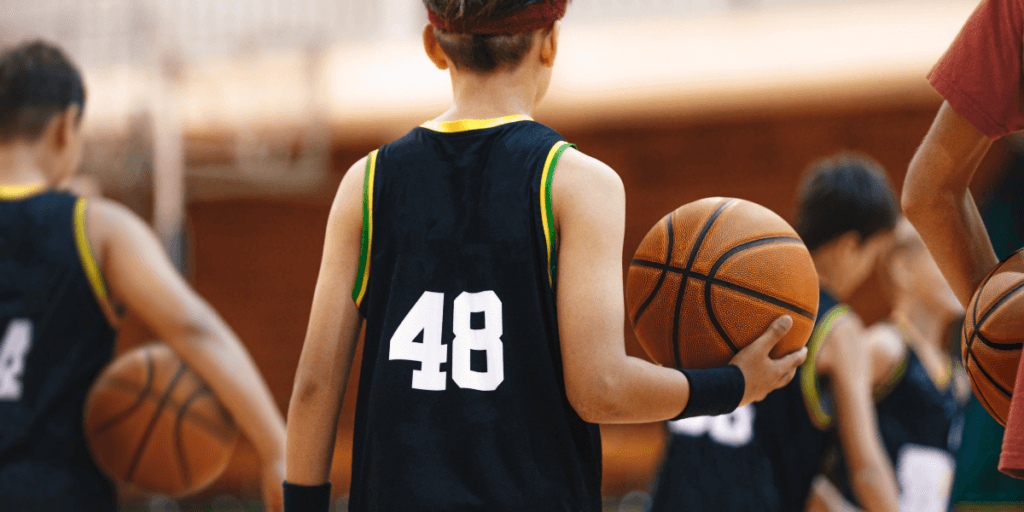 kid playing basketball demonstrating a nutrition program for kids and teens