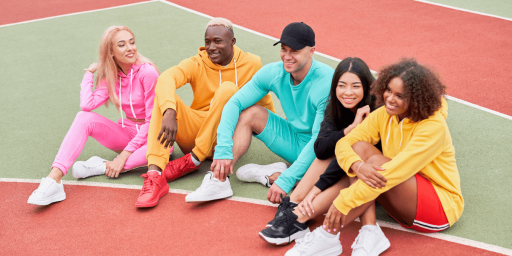 people sitting around after aworkout wearing athleisure showcasing how a nutrition business can collaborte with a local atheisure business owner